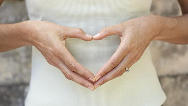 Woman Making a Heart Shape with Her Hands